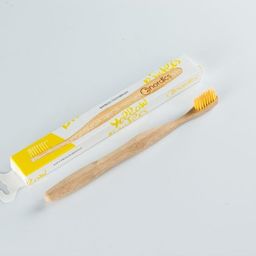 Bio-degradable toothbrush with colored fibers