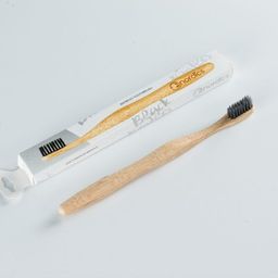 Bio-degradable toothbrush with activated carbon